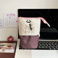 Brown Korean style collapsible Oxford fabric pencil case showing large capacity.