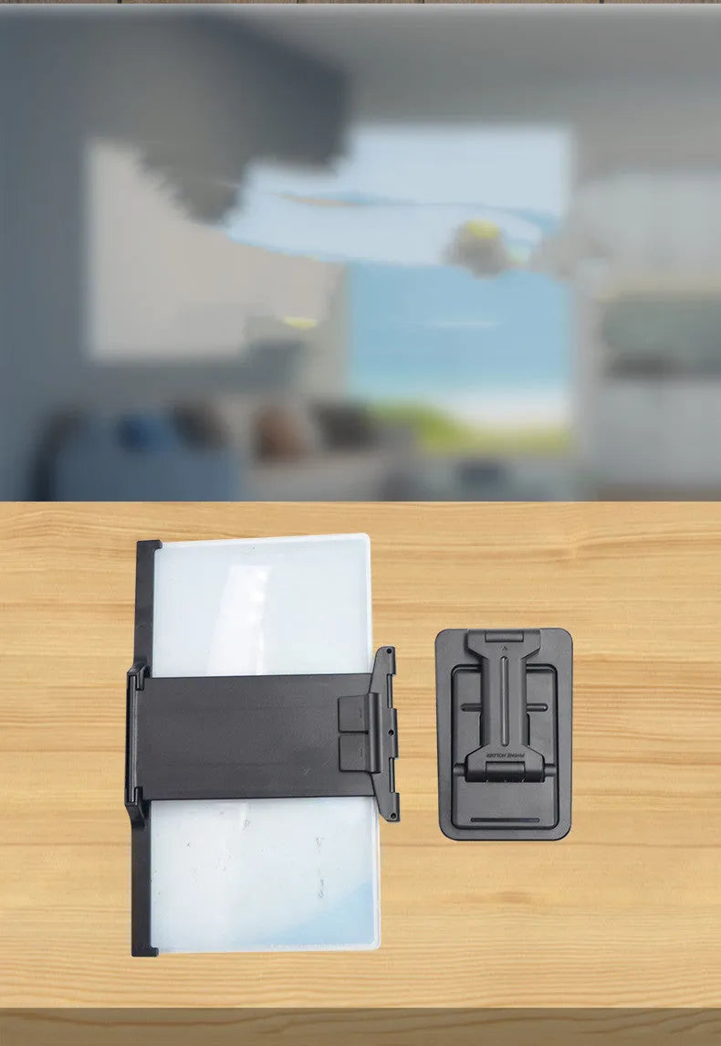 Black 12 inch mobile phone screen amplifier with detachable folding phone holder on desktop