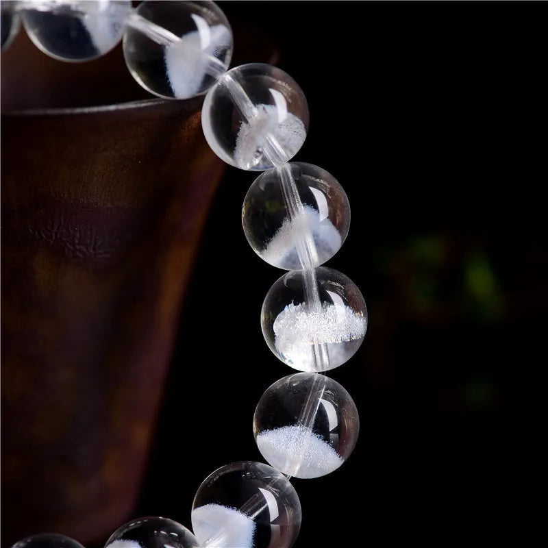 Women's white crystal pyramid ghost bracelet with Ruyi charm showing multiple bead size options