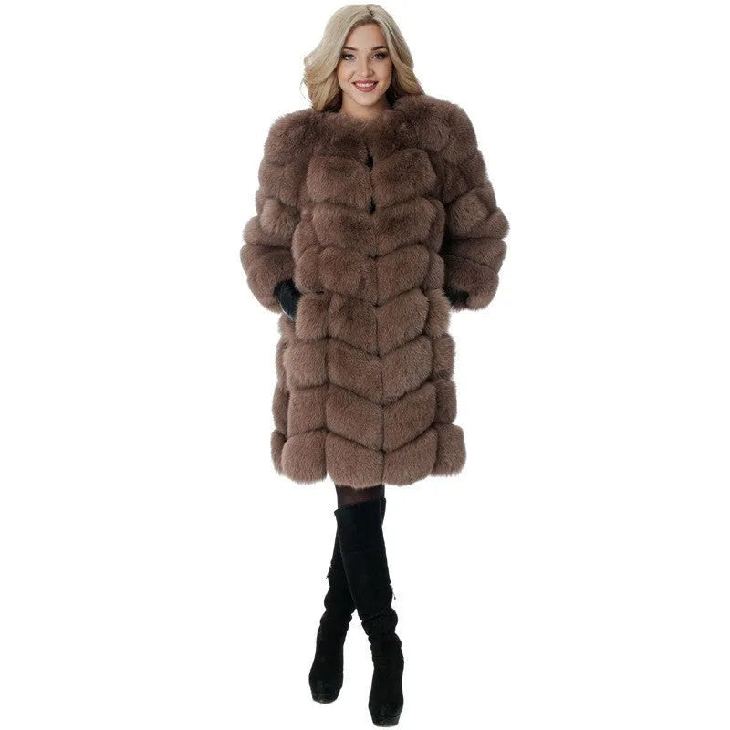 Women's long black faux fur coat with regular sleeves on a hanger