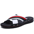 Men's cowhide leather flip-flops in black on a white background, showing the non-slip PU sole.