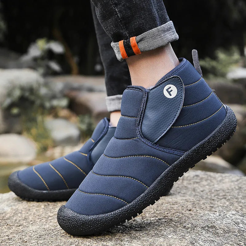 Unisex couple snow boots in black with a cotton upper, rubber sole, and plush lining.