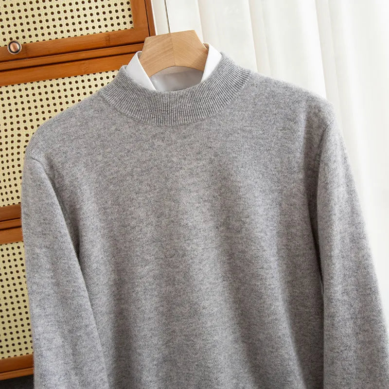 Man wearing a loose-fit half-collar wool sweater in a winter business casual style.