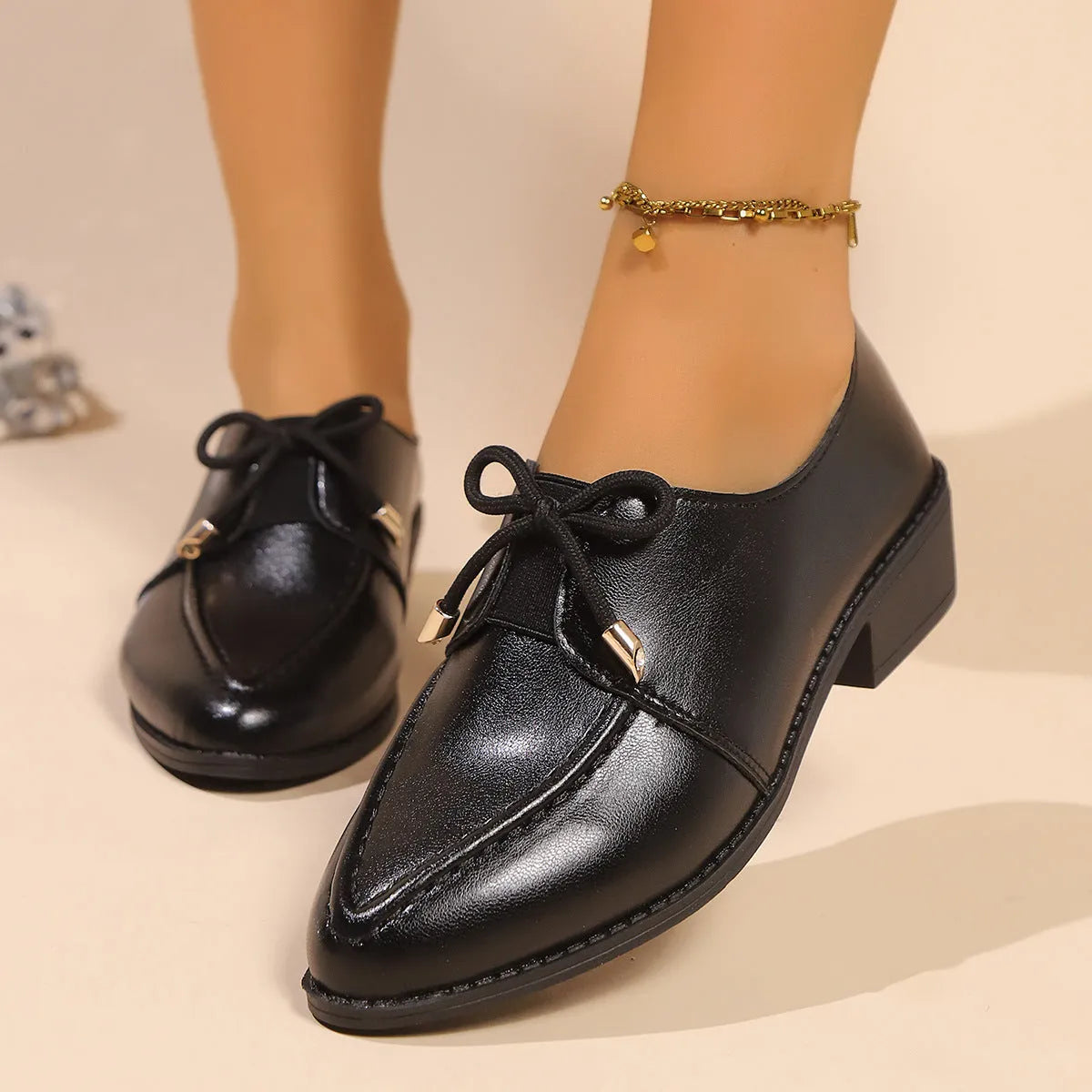 Women's flat shoes with a pointed toe and a choice of bow or buckle detail on the upper.