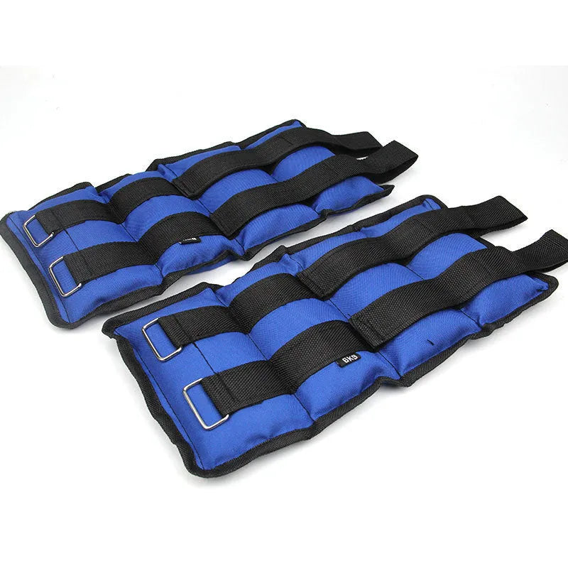 Pair of Oxford cloth legging sandbags for weighted athletic training on a track.