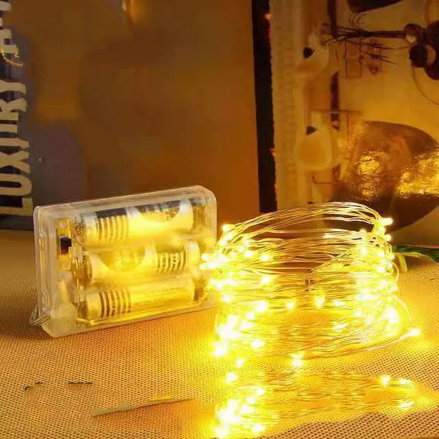 12-metre copper wire LED string lights with 120 bulbs showing multiple colour options and USB power connection