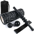 Black foam roller massage bar with gear-like segments, measuring 33cm in length