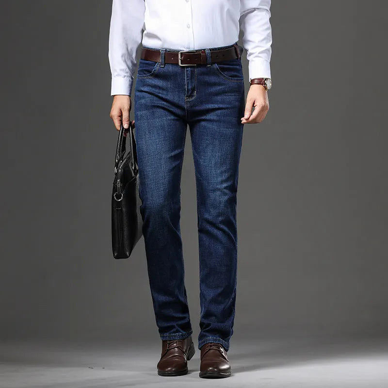 Women's loose fit black stretch jeans with a straight leg and zip fly, shown on a hanger.