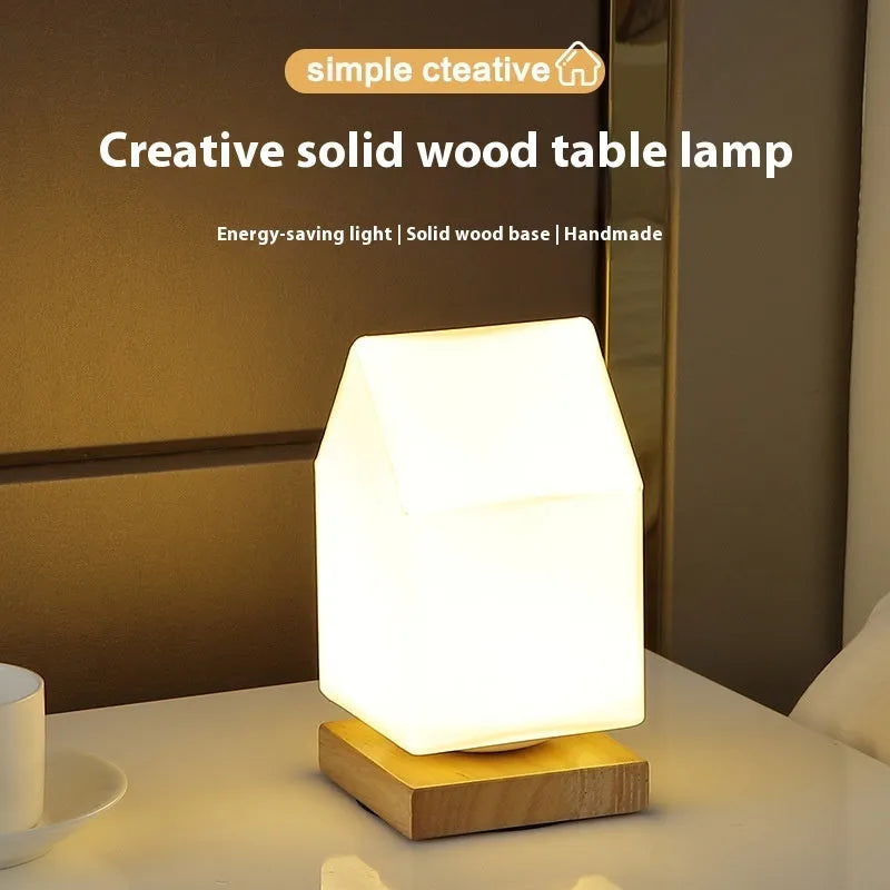 Nordic solid wood USB bedside lamp with flower-shaped design in white cylinder style on wooden surface