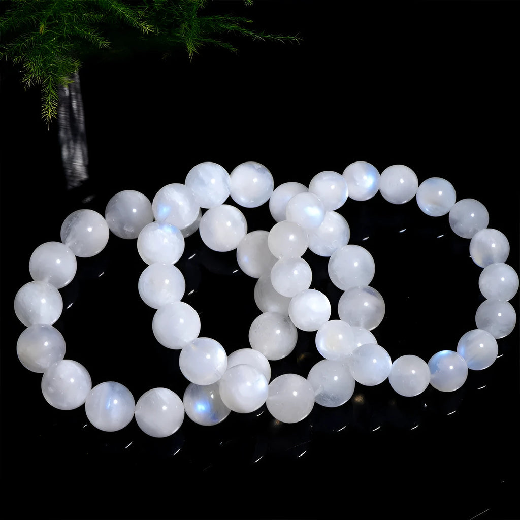 Natural blue moonlight moonstone round bead bracelet showing polished stone surface and blue sheen