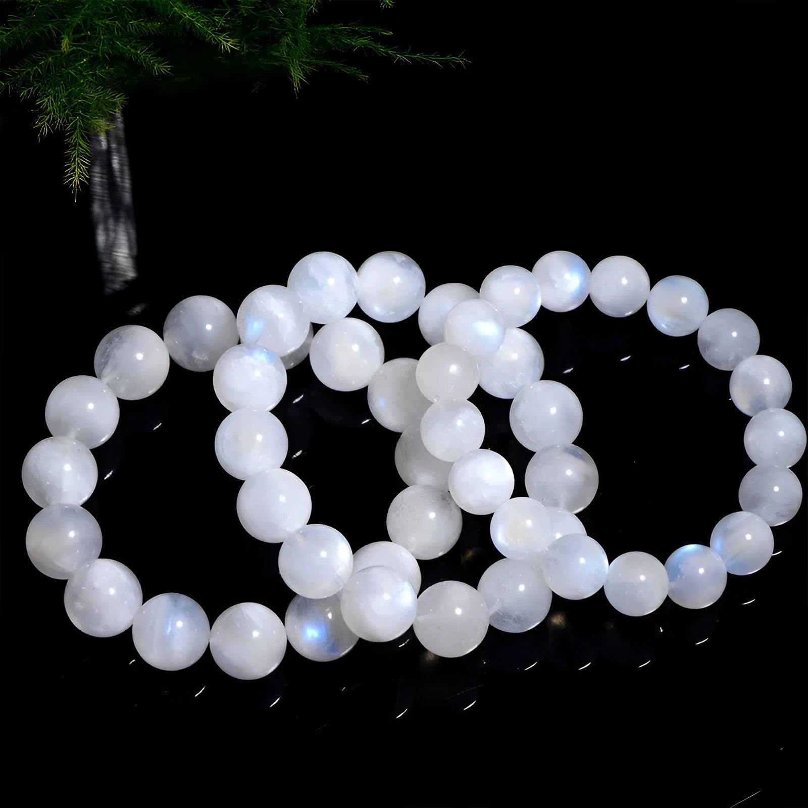Natural blue moonlight moonstone round bead bracelet showing polished stone surface and blue sheen