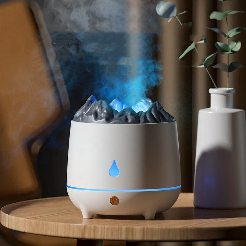 White volcano-shaped ultrasonic humidifier with USB cable on wooden surface