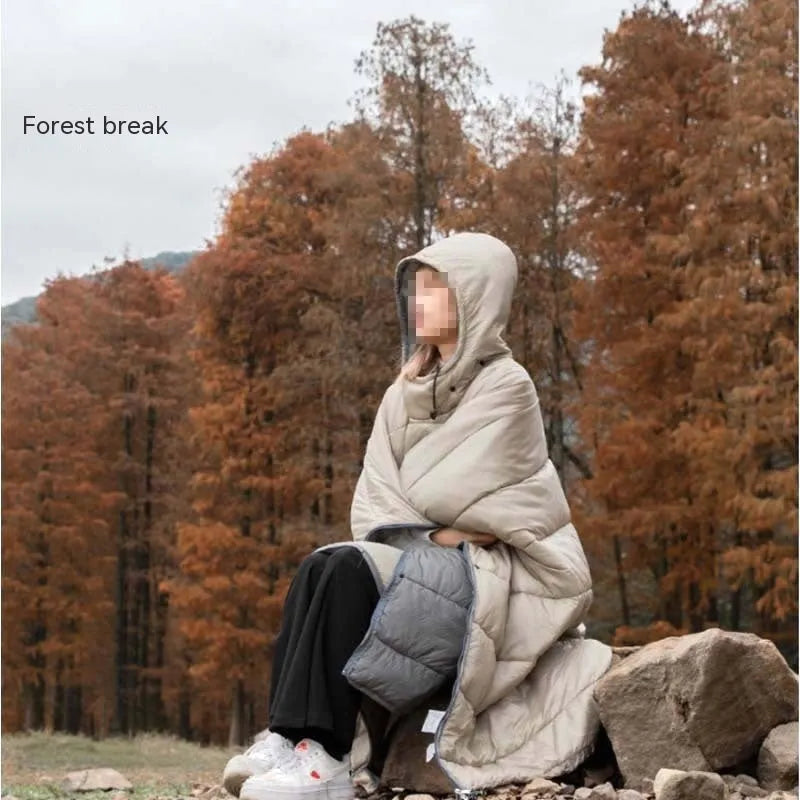 Outdoor cloak sleeping bag shown as wearable cape and flat 200x140cm blanket in army green