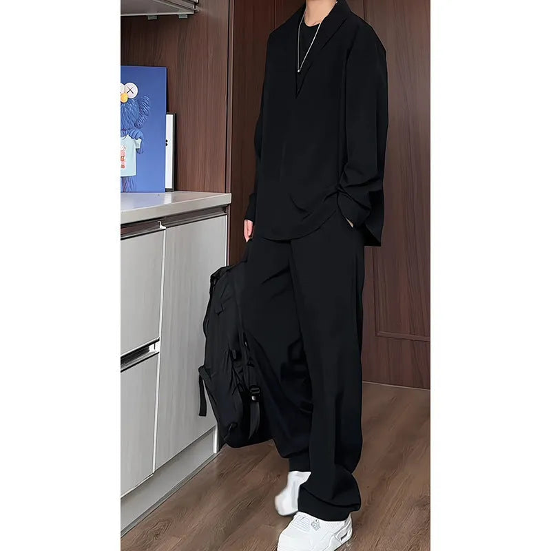 Men's black casual two-piece set with long sleeve polo shirt and matching trousers