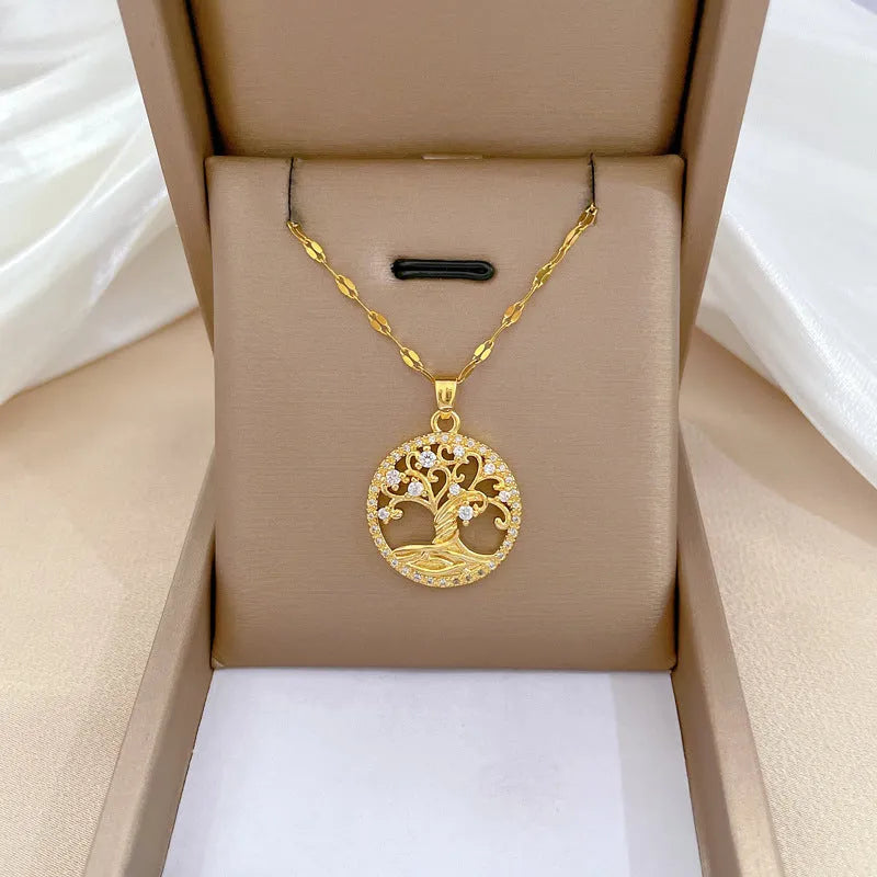 Gold-plated necklace with mother pearl pendant and rhinestone detailing on adjustable lip chain
