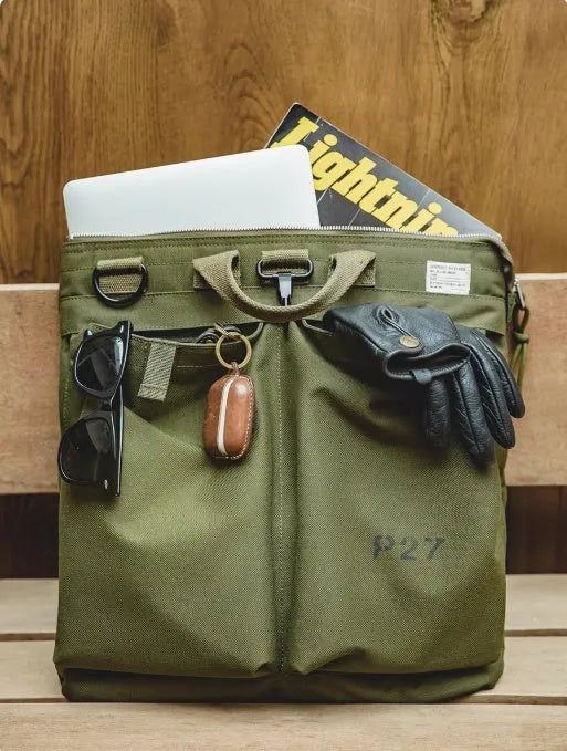 Canvas crossbody messenger bag in military green with 15 inch laptop compartment and shoulder strap