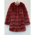 Women's long black faux fur coat with regular sleeves on a hanger