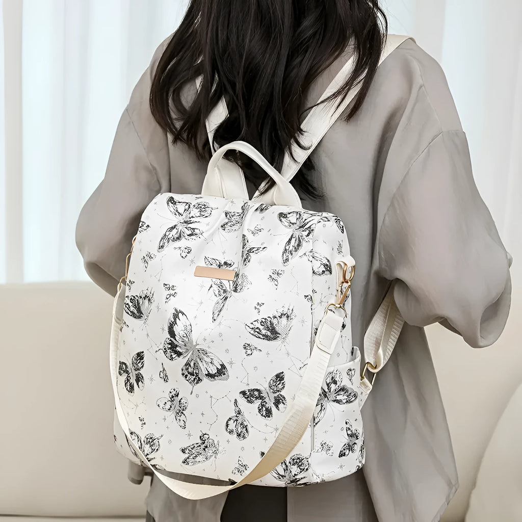 Butterfly printed PU backpack in blue with large capacity shoulder bag design and sewing line detailing