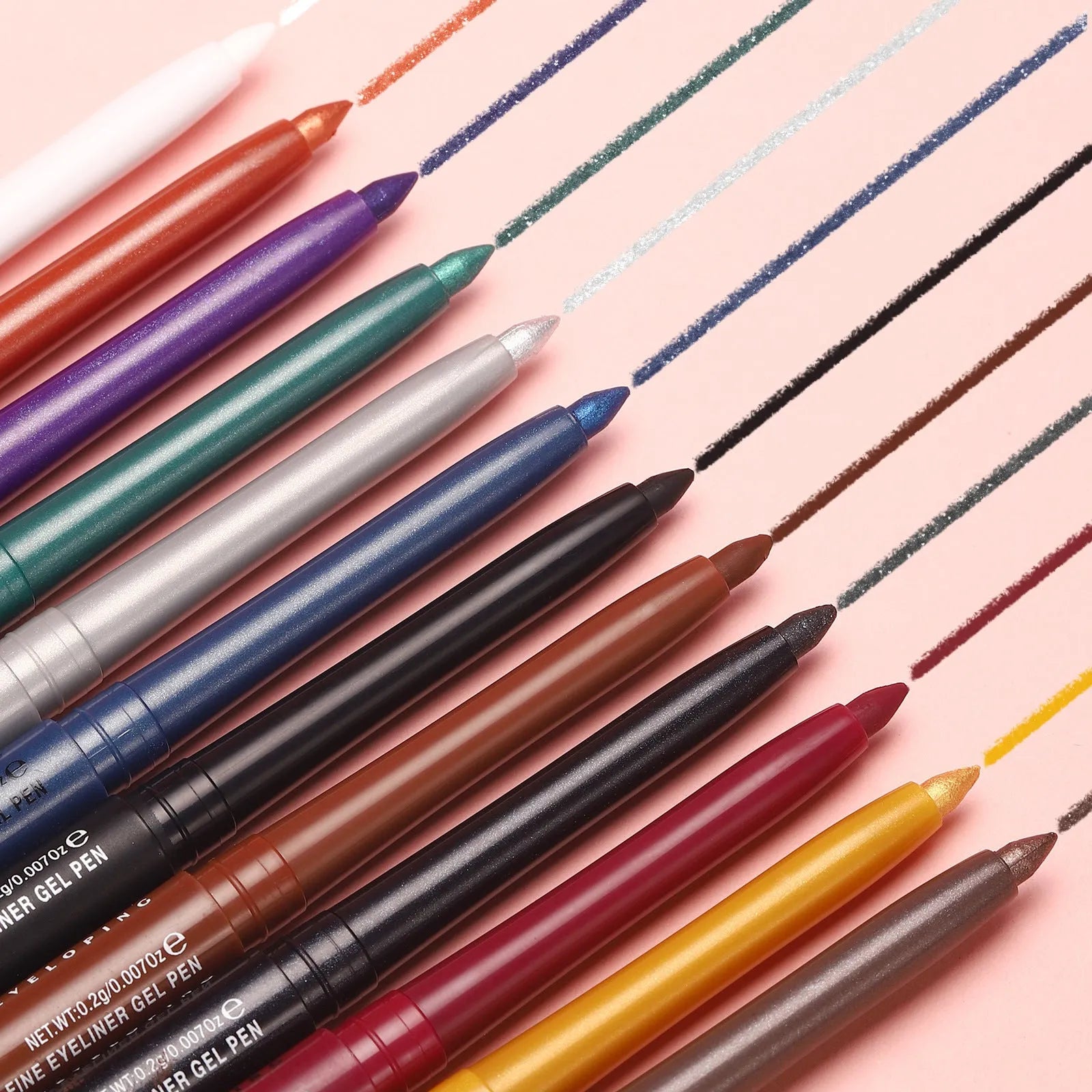 Set of 12 colourful gel glitter eyeliner pencils displayed in a row showing matte, glitter, and metallic shades.