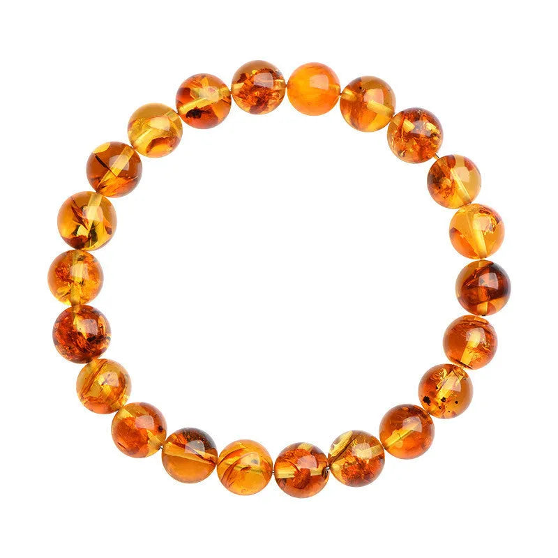Natural yellow piebald amber bracelet with geometric beads showing distinctive flower spot patterning
