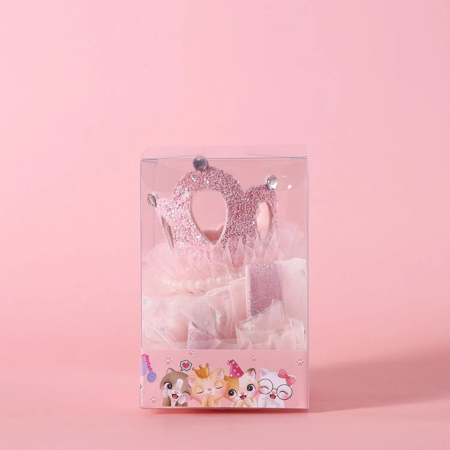 A beige and a pink princess crown headdress for cats on a white background.