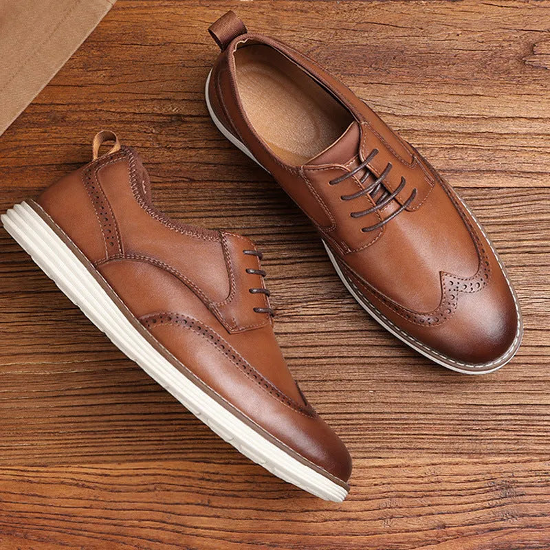 Men's black and brown slip-on business casual shoes with round toe and sculptured detailing