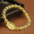 Yellow Pi Xiu bracelet with artificial crystal on leather strap in Chinese folk style design