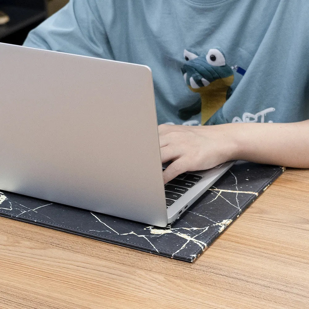 Soft PVC heat-insulating anti-radiation pad for laptops in black, blue, green, and black gold colours.