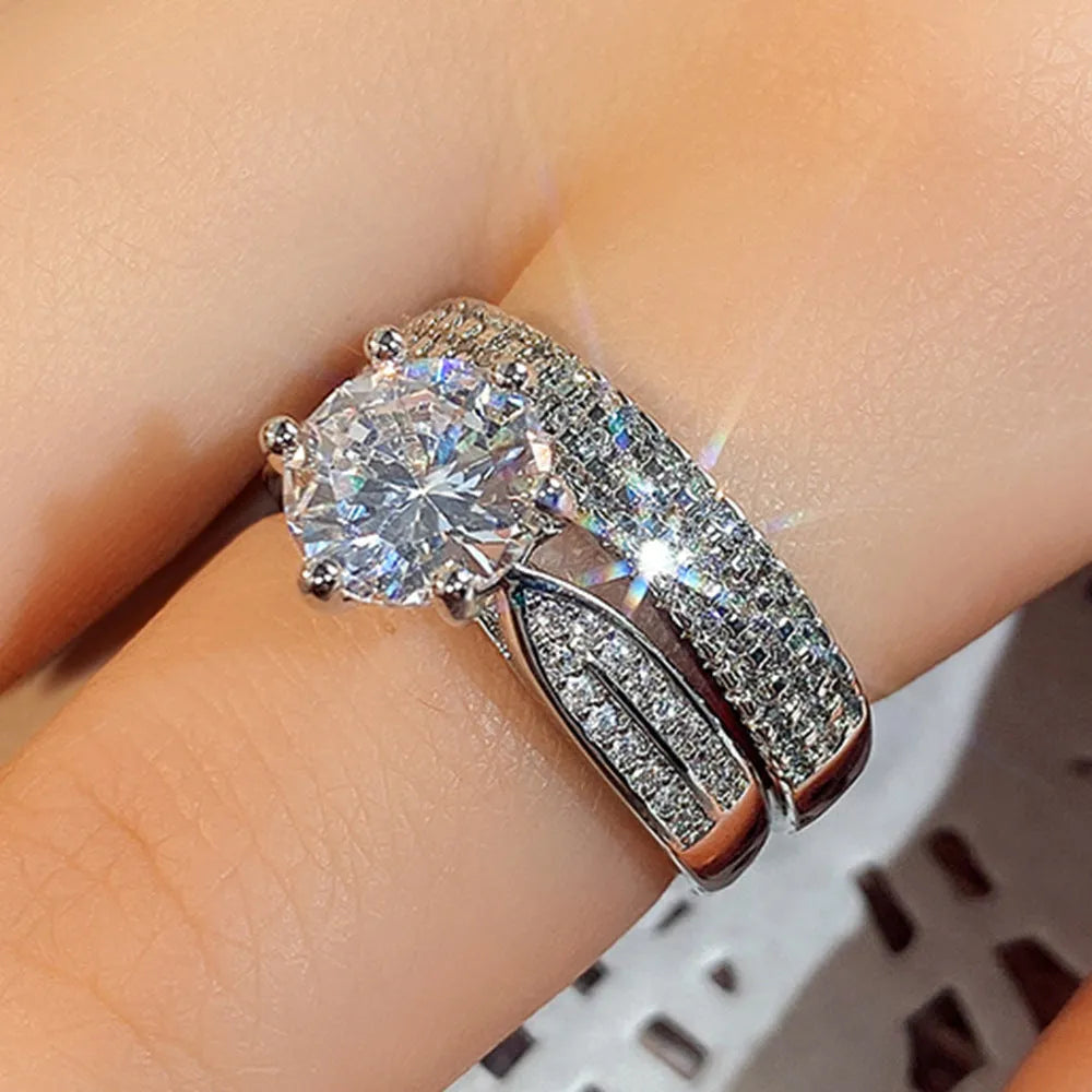 Geometric white gold colour wedding ring bracelet with round detail, shown in size options 5 to 11