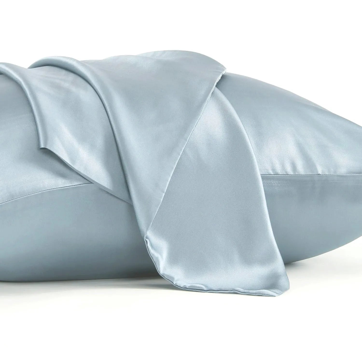 Dark gray 19 M silk envelope pillowcase with envelope closure on a bed.