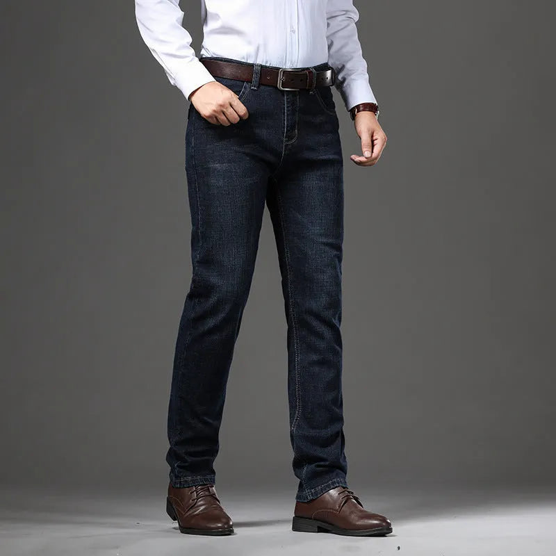 Women's loose fit black stretch jeans with a straight leg and zip fly, shown on a hanger.