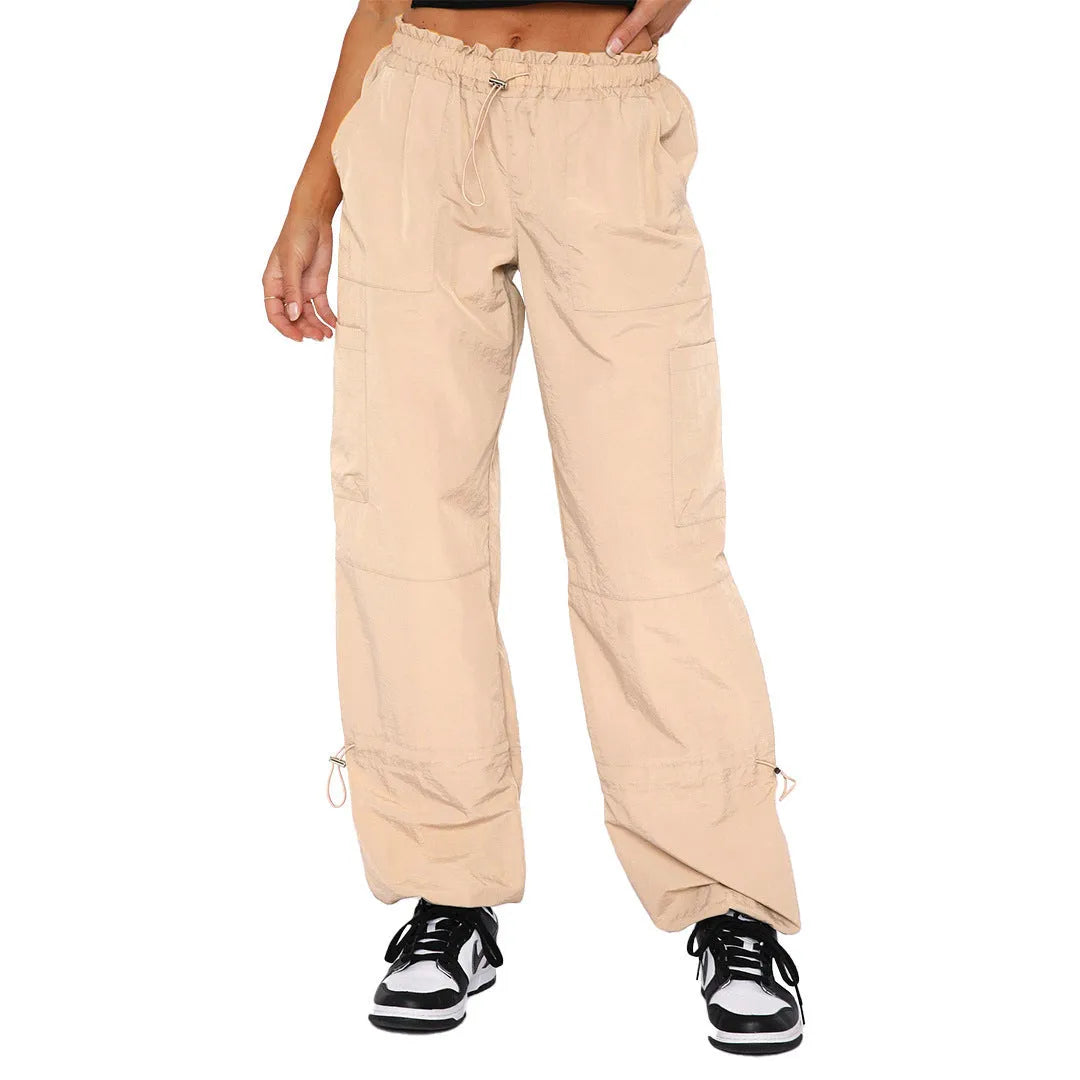 Loose fit straight-leg multi-pocket cargo casual pants in polyester fabric.