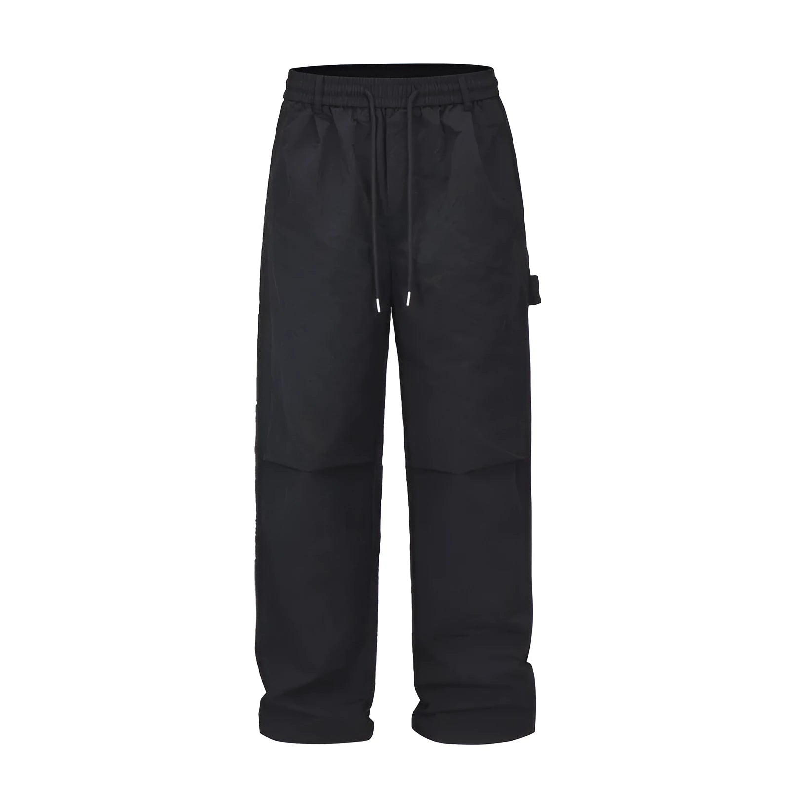 Men's baggy paratrooper pants in black with elastic waist and drawstring, side view on model