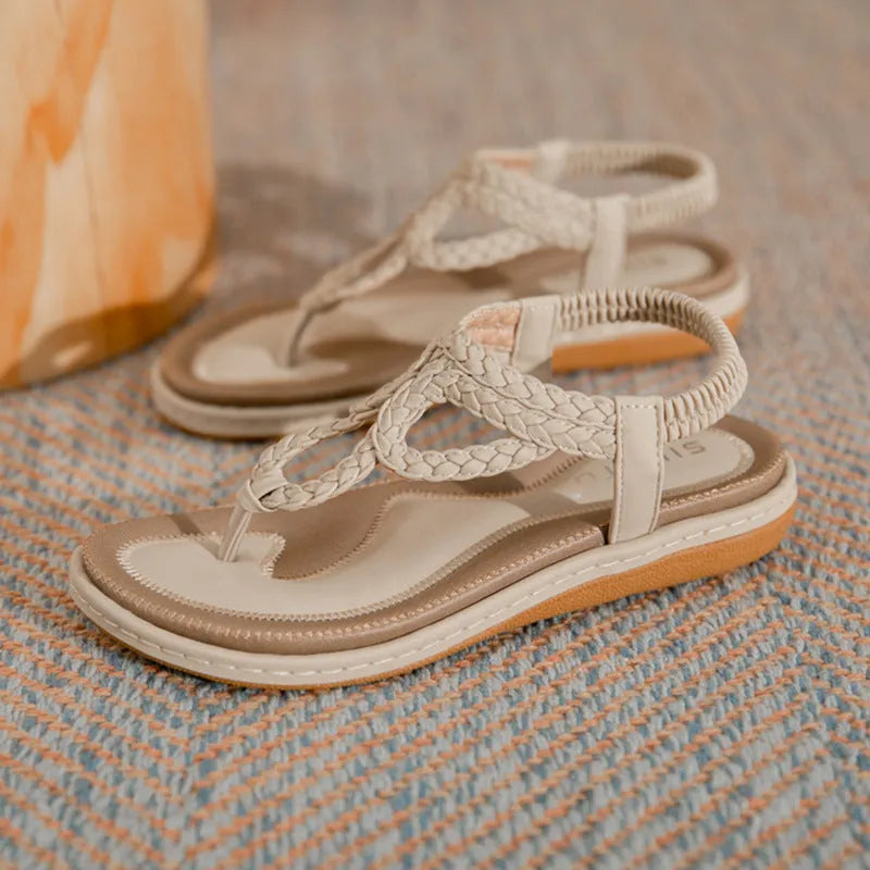 Women's woven flat sandals in solid colour low top with rubber sole, available in black apricot or sapphire blue