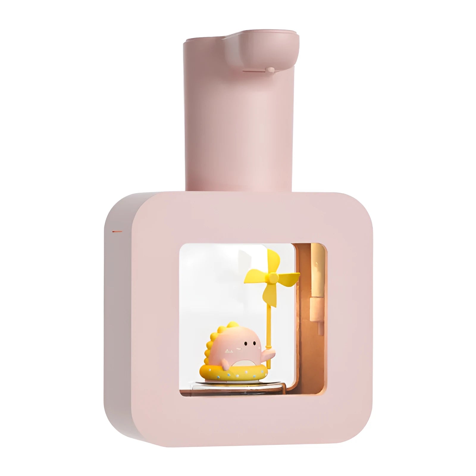 Pink automatic soap dispenser for kids with cartoon unicorn and kitten design on a bathroom counter.