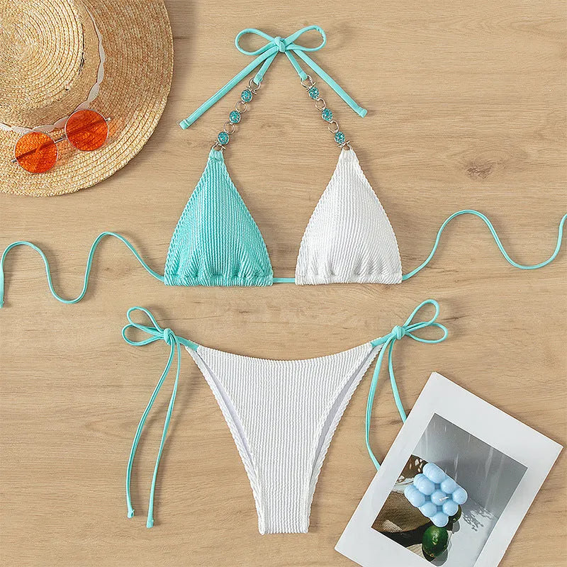 Women's colour-matching swimsuit bikini set with lace-up front and pearl chain on sleeveless top.