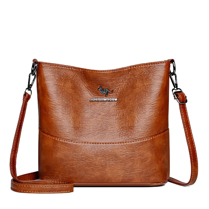 Women's solid colour soft leather shoulder bag with sewing line in black, ginger yellow, or wine red