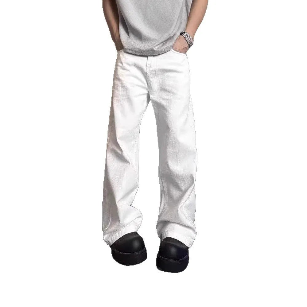 Men's white straight-leg wide fit cotton denim jeans on a neutral background.