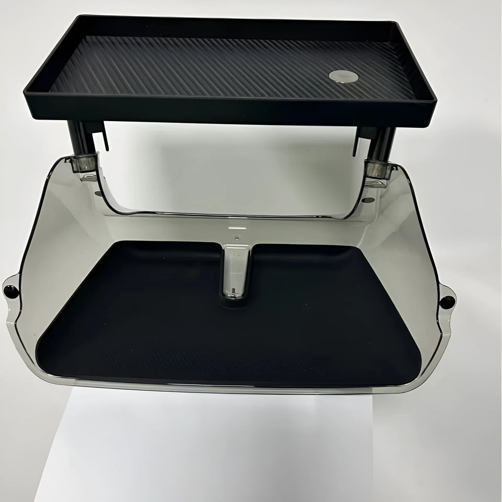 White ABS plastic storage box fitted under the screen of a Tesla Model 3 for small items