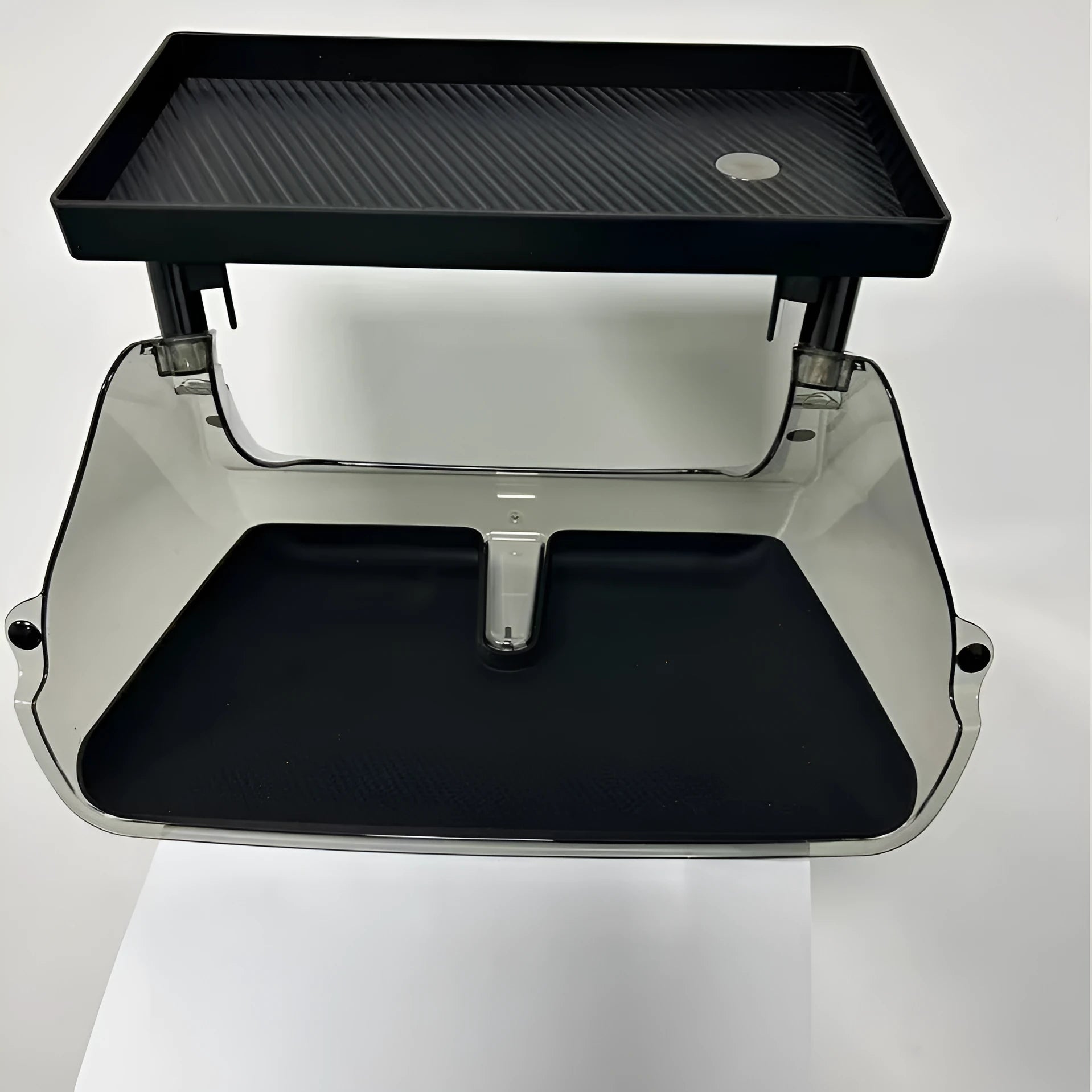 White ABS plastic storage box fitted under the screen of a Tesla Model 3 for small items