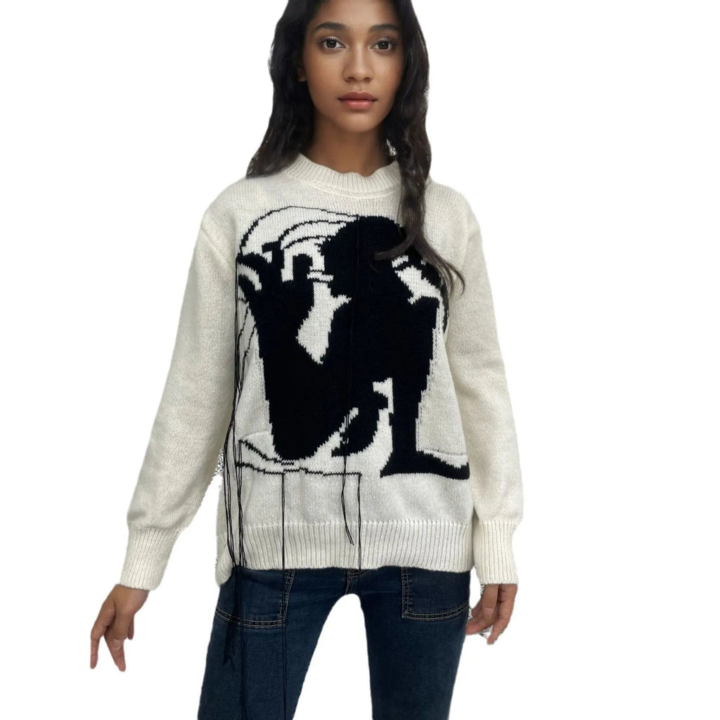 Women's loose alpaca wool tassel sweater in gray, round neck pullover style, side view on model