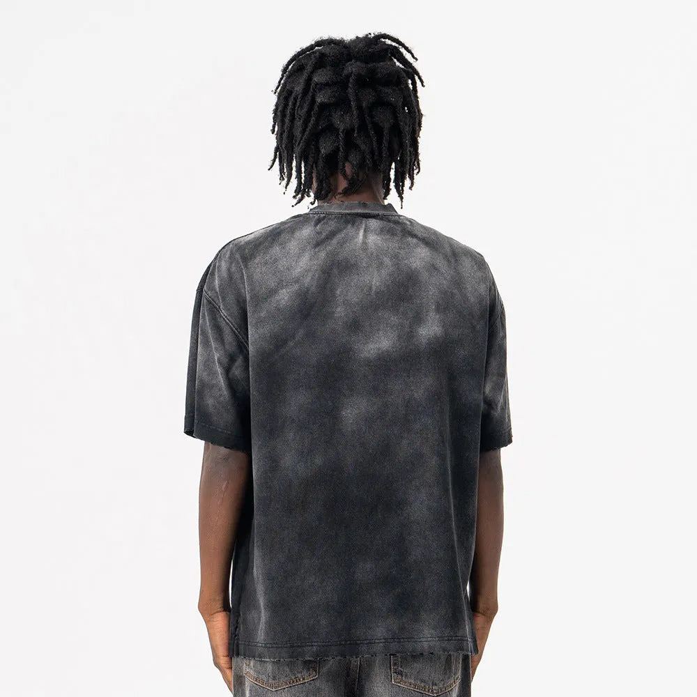Black men's loose fit graphic t-shirt with drop shoulder sleeves on mannequin