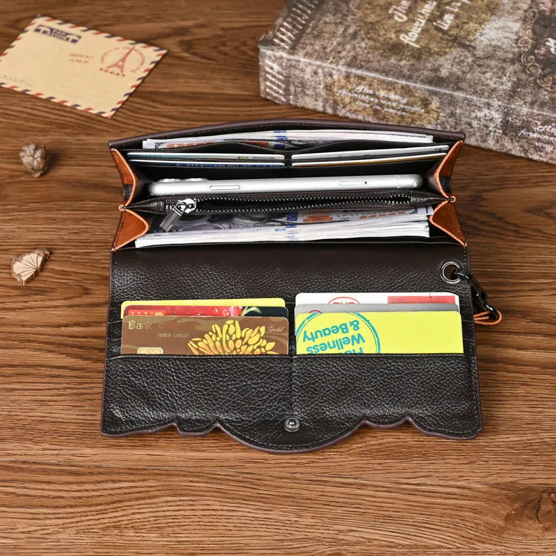 Retro brown tri-fold women's wallet with an embossed floral pattern, made from cowhide leather.