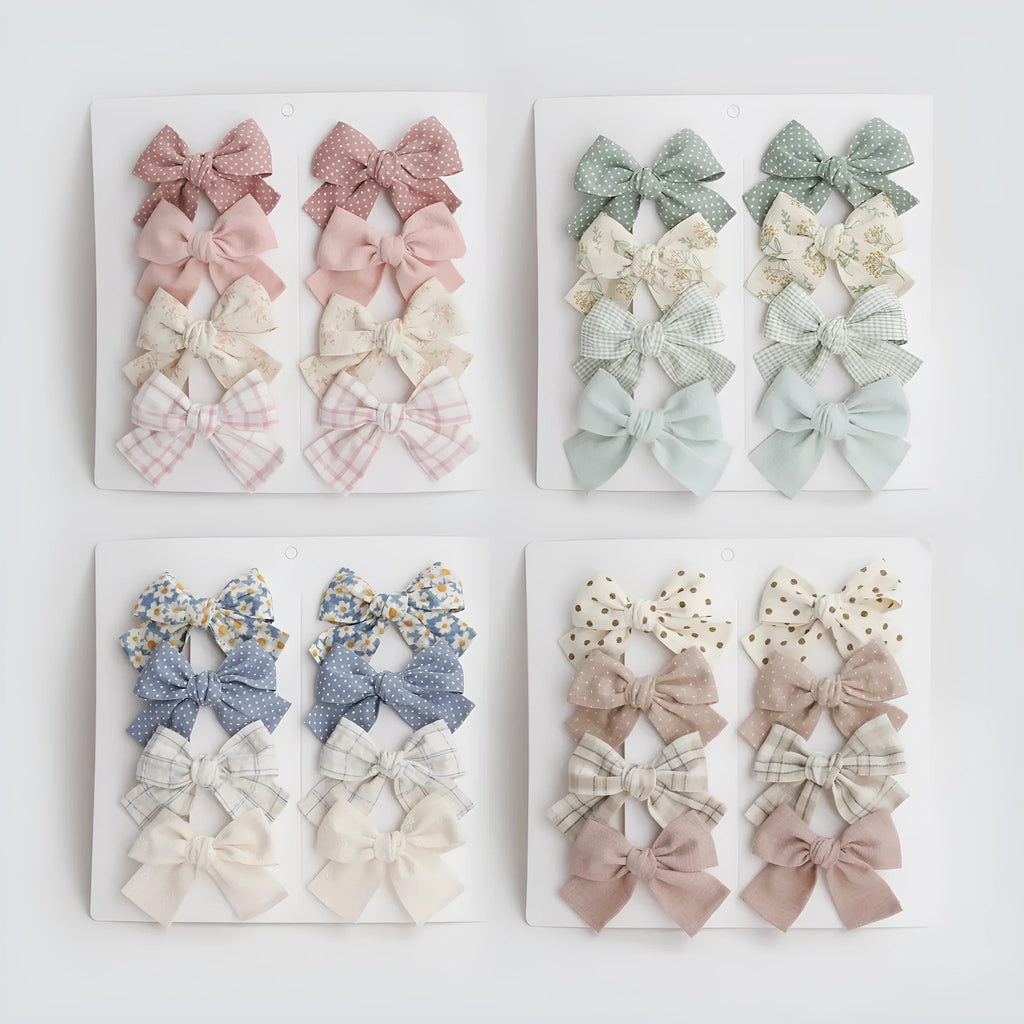 Children's cloth bow hairclips in eight-piece set with dovetail design