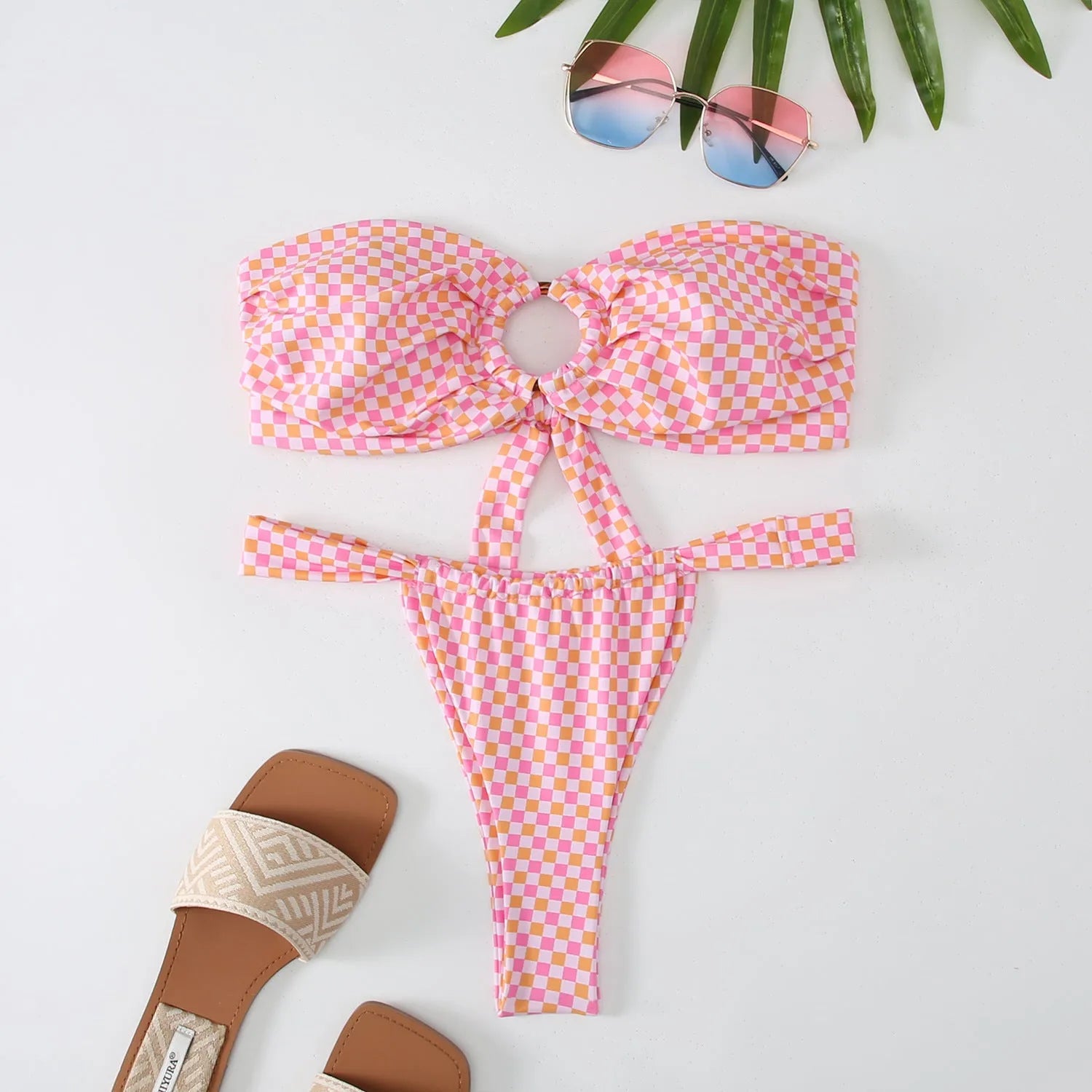 Women's floral print tube top ring bikini swimsuit set with matching briefs, shown in a backless design.