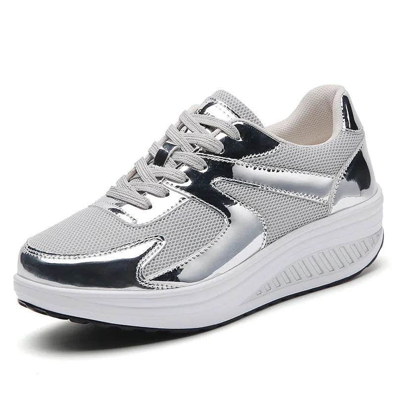 Women's gold thick bottom mesh elevator cross strap shoes with round toe and waterproof platform on light background