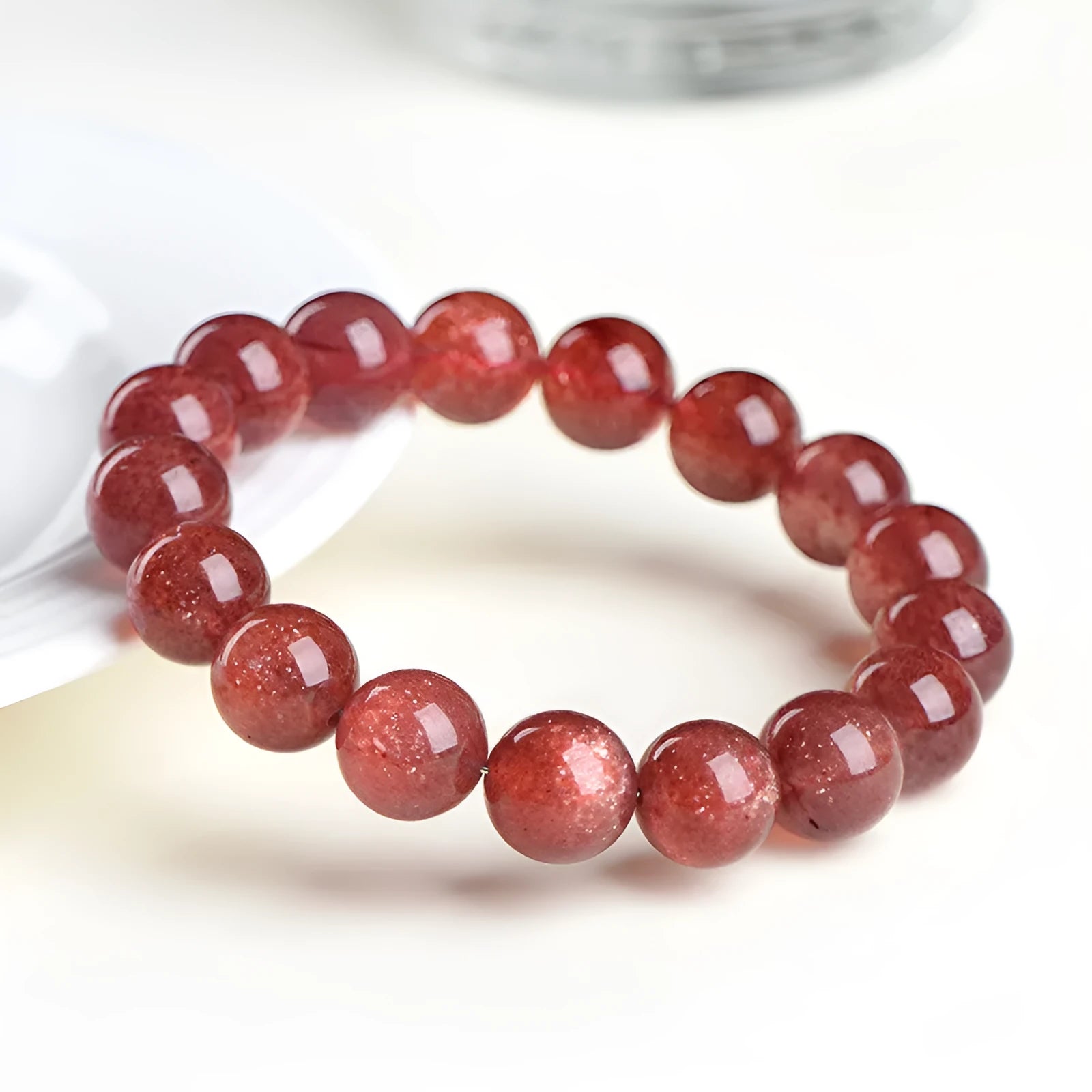 Natural strawberry quartz bracelet with geometric beads in starlight cherry red colour showing three bead size options