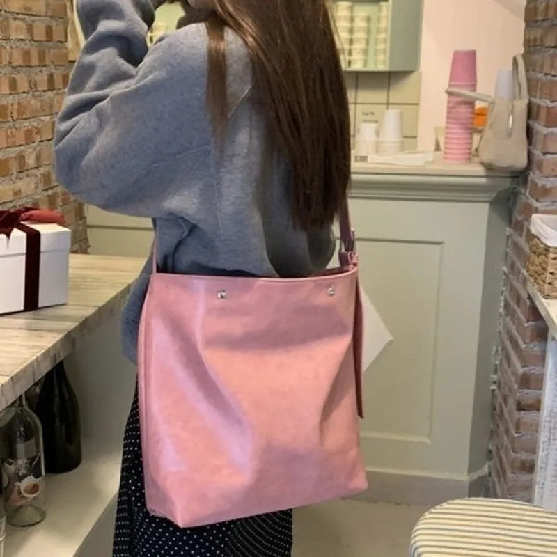 Corduroy one-shoulder commuter bag in pink or brown with PU lining, showing 39cm length dimensions