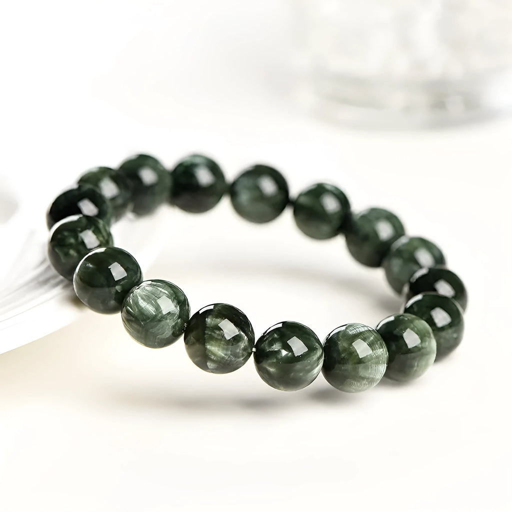 Natural green Grade 7A Dragon Crystal bracelet with 8-9mm round beads and a Ruyi design element.