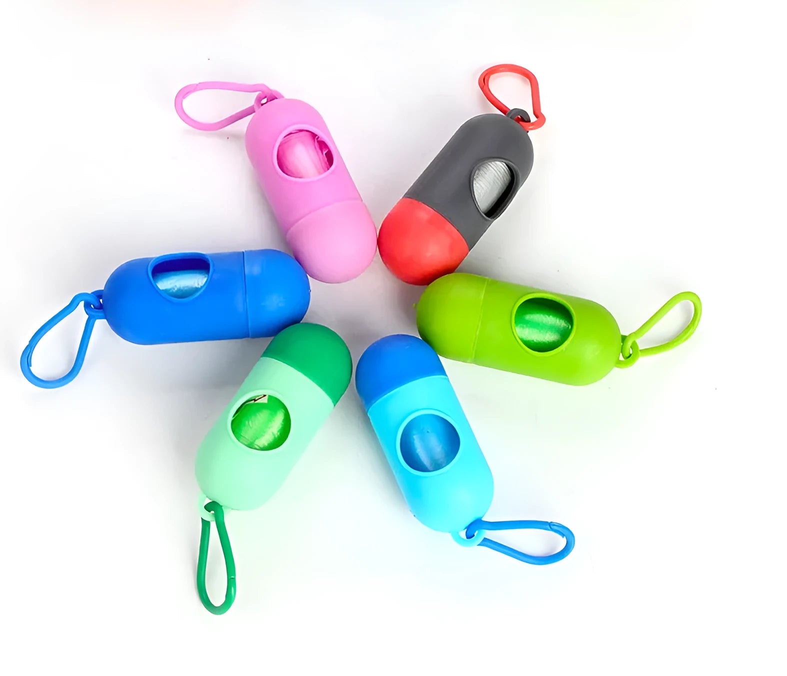 Roll of coloured dog waste bags showing black, blue, green, pink, and purple options.